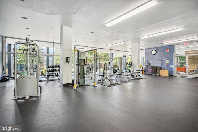 gym with expansive windows and a wealth of natural light