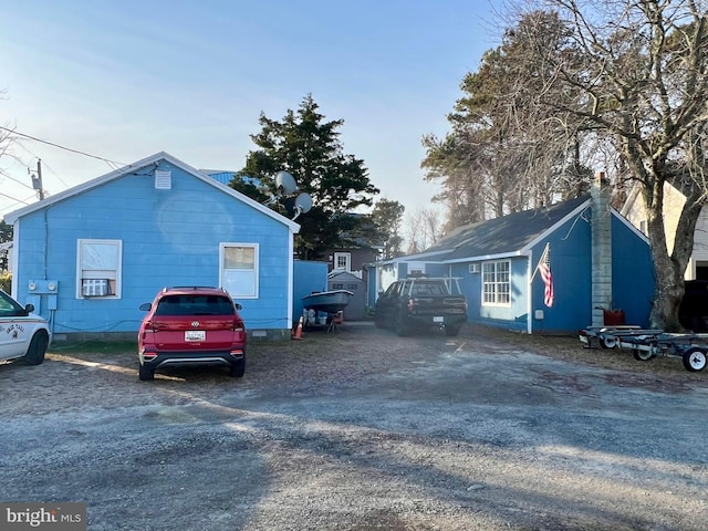 view of side of property with cooling unit