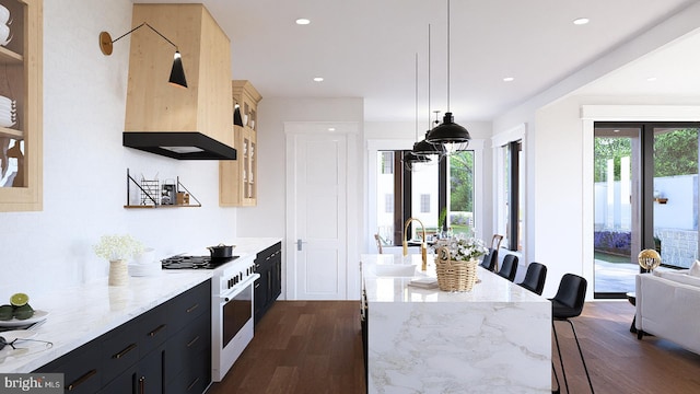 kitchen with light stone countertops, pendant lighting, a kitchen bar, dark hardwood / wood-style floors, and gas range