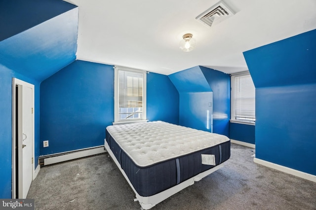 unfurnished bedroom with dark carpet, vaulted ceiling, and a baseboard heating unit