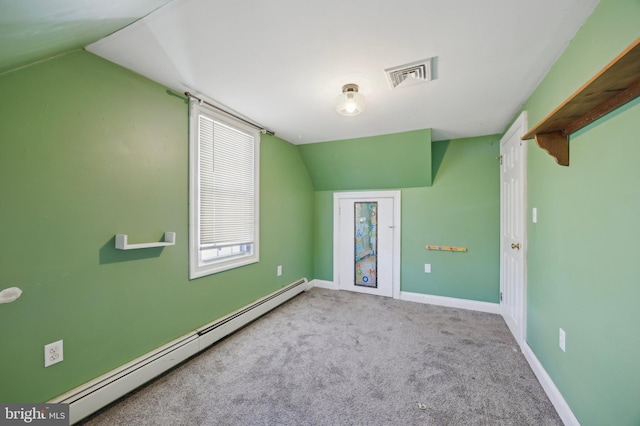 bonus room with light carpet, lofted ceiling, and a baseboard heating unit