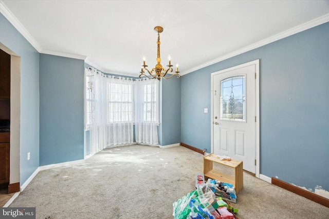 carpeted entryway with crown molding and a notable chandelier