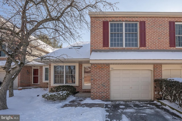 townhome / multi-family property featuring a garage