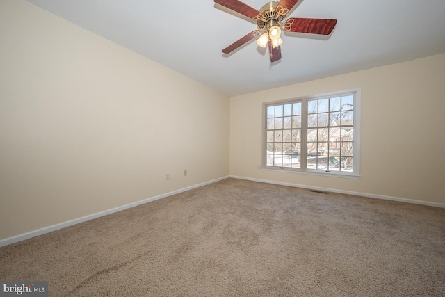 carpeted empty room with ceiling fan and lofted ceiling