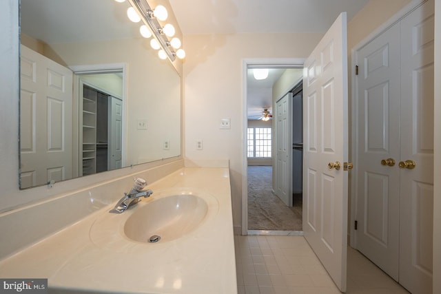 bathroom featuring a chandelier and vanity