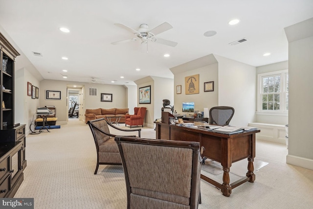 office with light carpet and ceiling fan