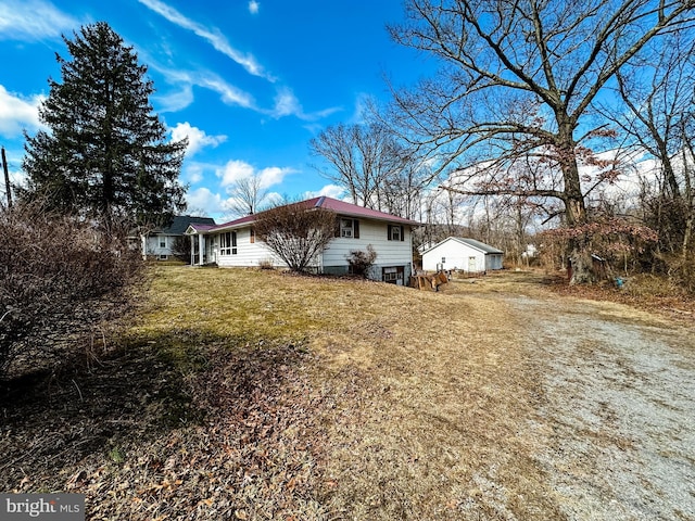 exterior space with a lawn and driveway