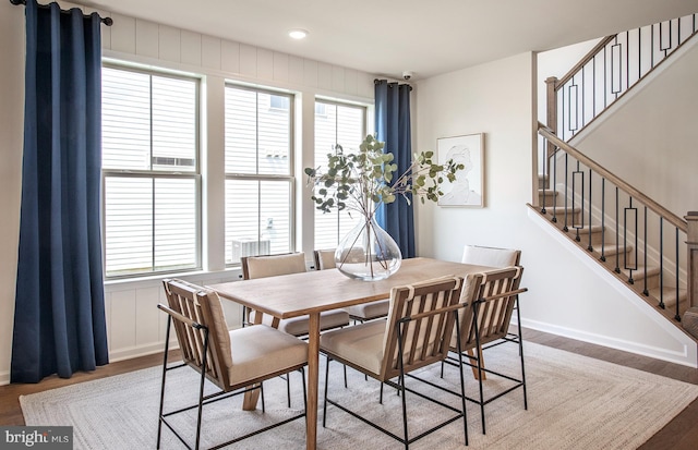 dining space featuring plenty of natural light and wood-type flooring