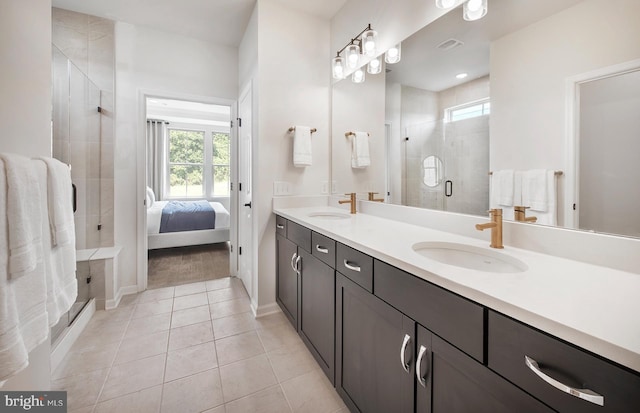 bathroom featuring vanity, tile patterned floors, and an enclosed shower