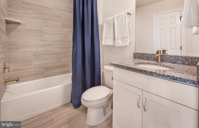 full bathroom with vanity, toilet, and shower / bath combo with shower curtain