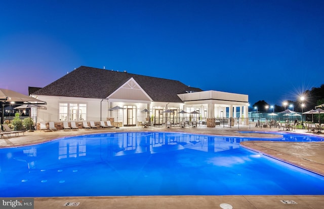 view of pool featuring a patio area and french doors