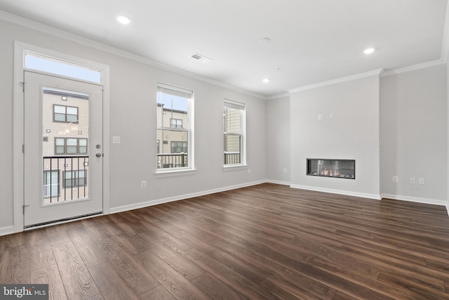 unfurnished living room with ornamental molding and dark wood-type flooring