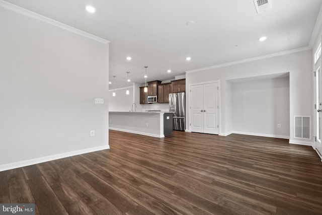 unfurnished living room featuring dark hardwood / wood-style flooring and ornamental molding