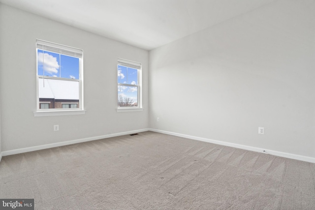 spare room with carpet floors