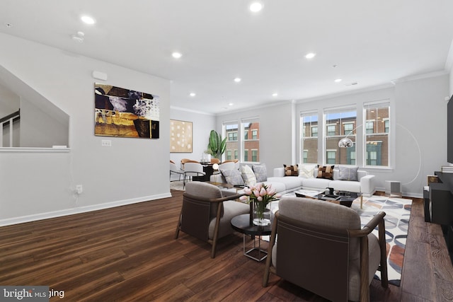 living room featuring dark hardwood / wood-style flooring and crown molding