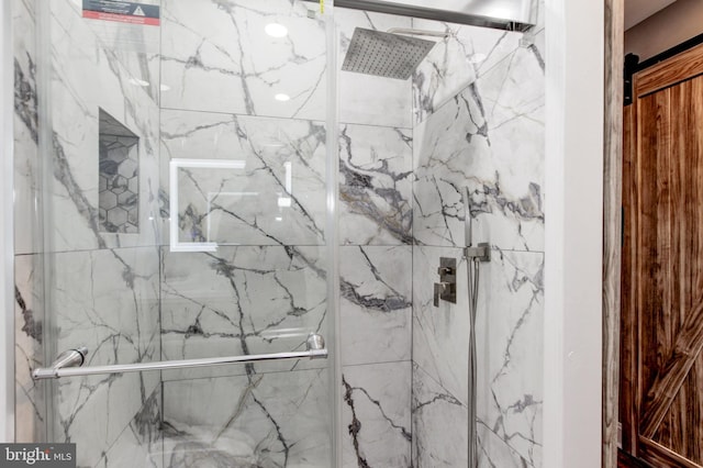 full bath with a marble finish shower