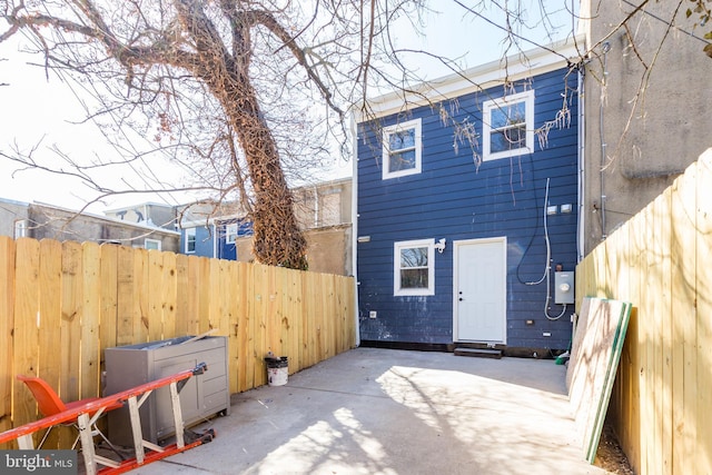 back of house with a patio area and fence