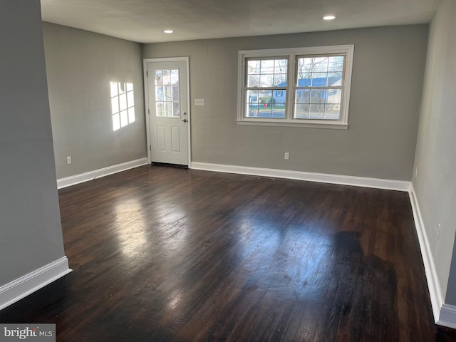 foyer with dark hardwood / wood-style floors