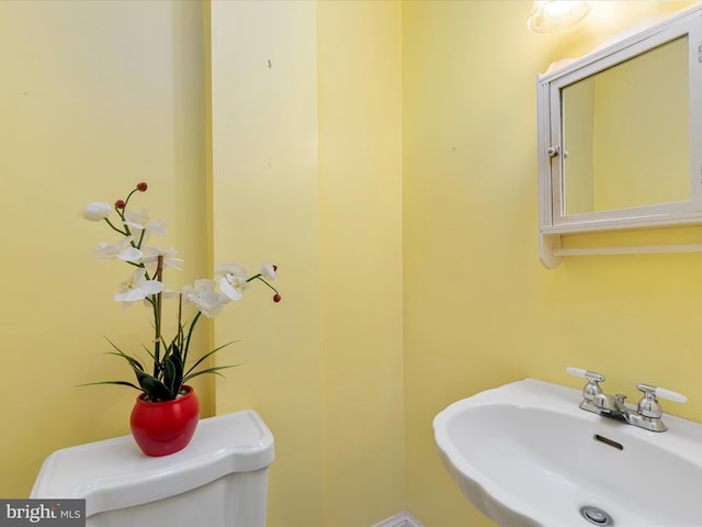 bathroom with sink and toilet