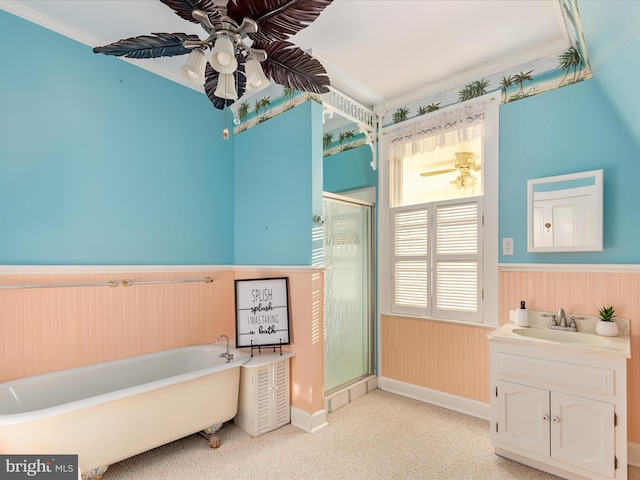 bathroom with separate shower and tub, ceiling fan, vanity, and ornamental molding