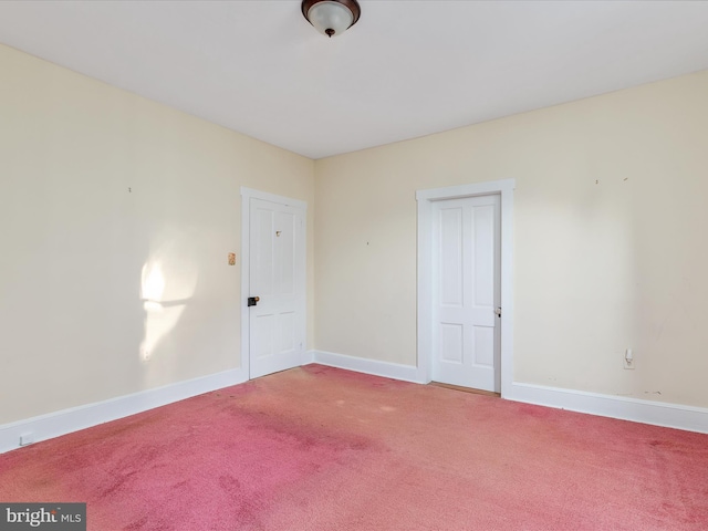 unfurnished room featuring carpet