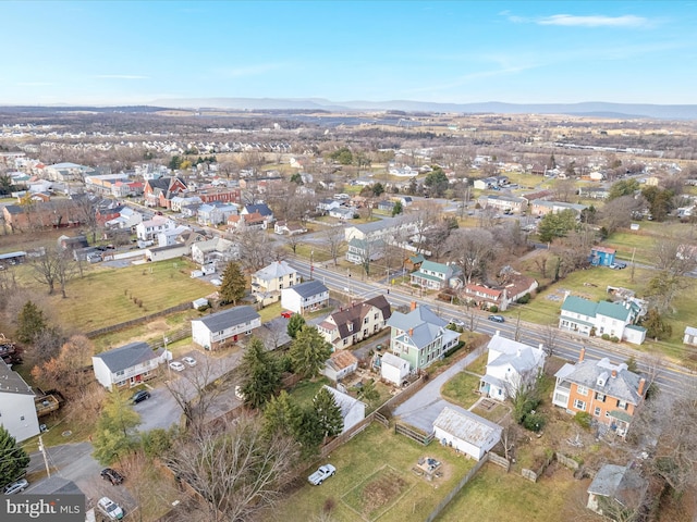 birds eye view of property featuring a mountain view