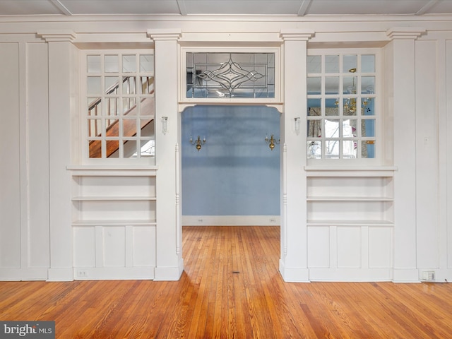 interior space featuring hardwood / wood-style flooring and built in shelves