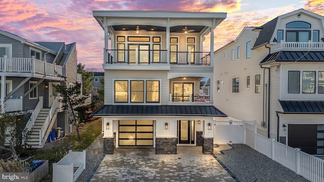 exterior space with a balcony and a garage