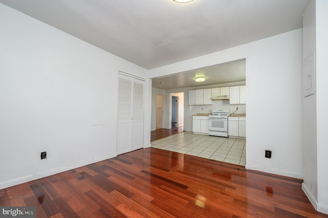 unfurnished living room with light hardwood / wood-style floors