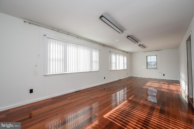 unfurnished room featuring hardwood / wood-style flooring