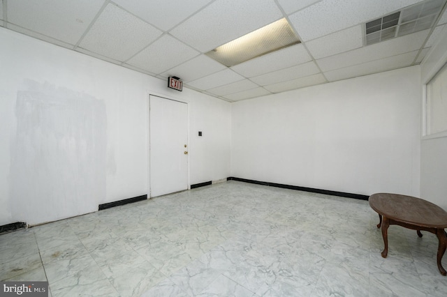 empty room with a drop ceiling