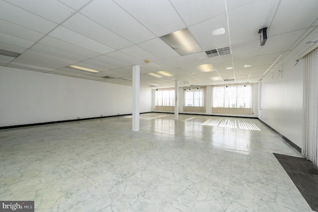 spare room featuring a paneled ceiling