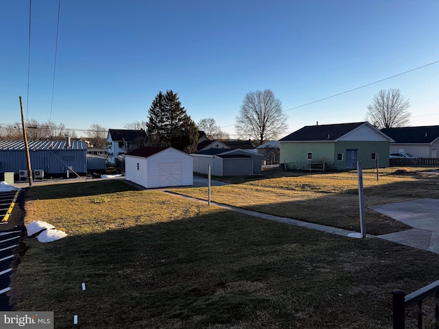 view of yard with a storage unit