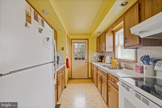 kitchen featuring sink and white appliances