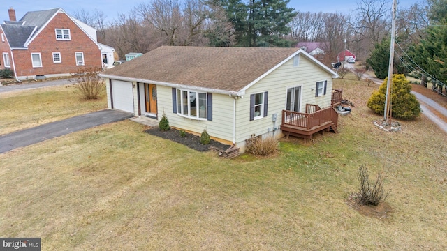 view of front facade featuring a garage and a front lawn