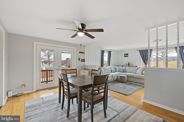 dining area featuring light hardwood / wood-style floors, french doors, and ceiling fan