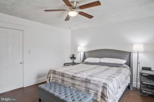 bedroom featuring dark hardwood / wood-style flooring and ceiling fan