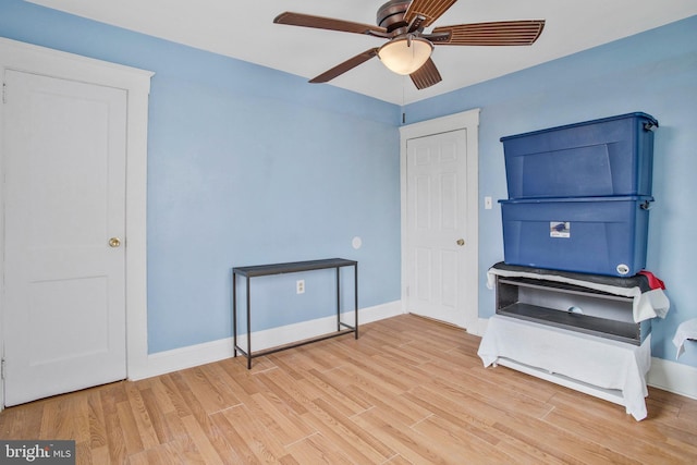 miscellaneous room with light hardwood / wood-style flooring and ceiling fan