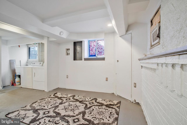 basement featuring washer and dryer and electric panel