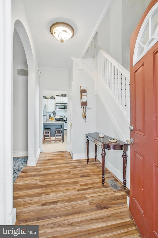 foyer with hardwood / wood-style floors