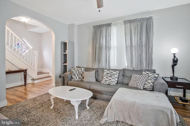 living room featuring ceiling fan and wood-type flooring