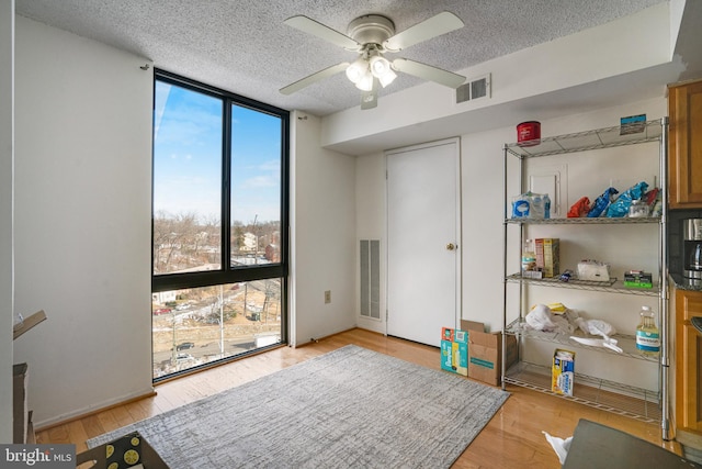 interior space featuring ceiling fan