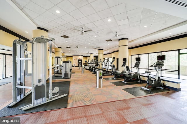 gym featuring a paneled ceiling and ceiling fan