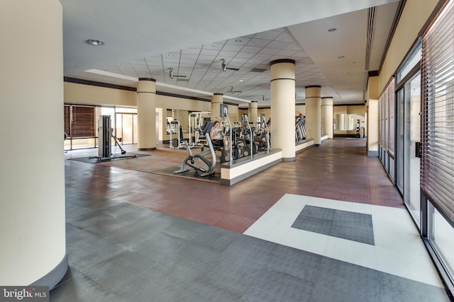 gym featuring a paneled ceiling