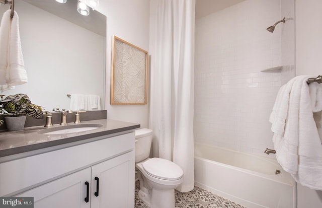 full bathroom with tile patterned floors, vanity, toilet, and shower / bath combo with shower curtain