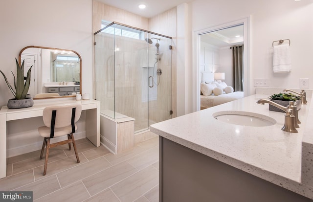 bathroom featuring vanity and an enclosed shower