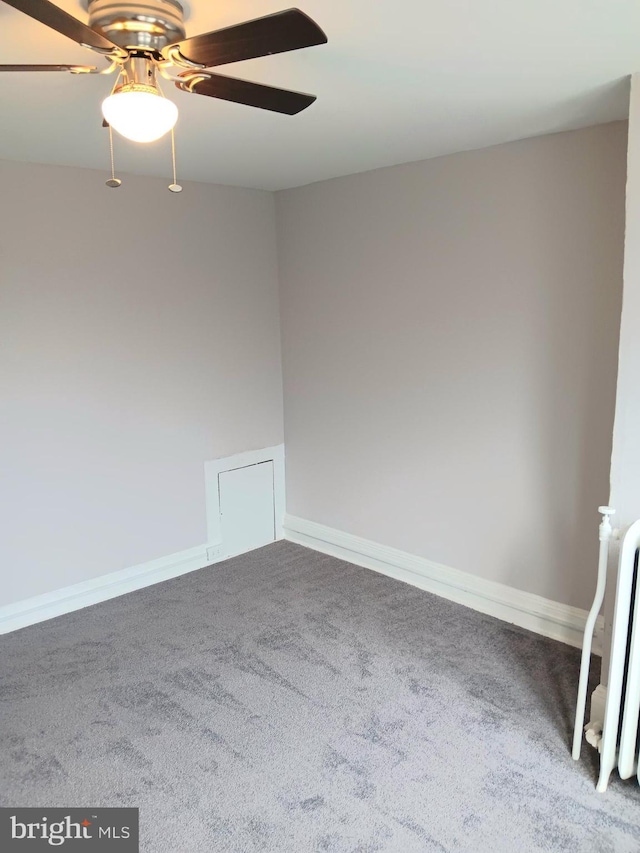 unfurnished room with ceiling fan and carpet flooring