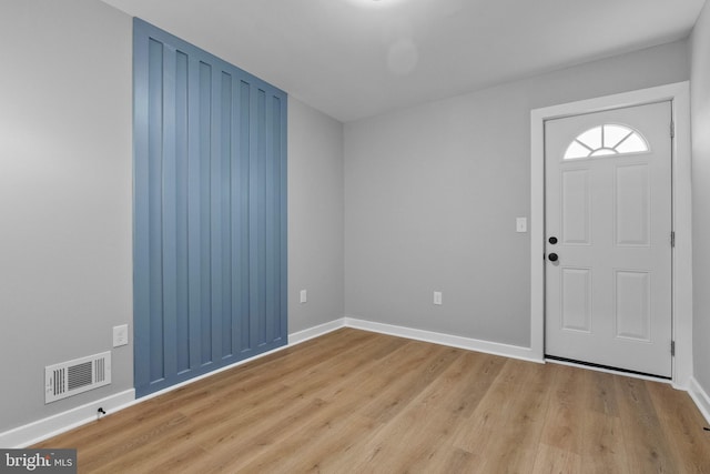 entryway with light hardwood / wood-style floors