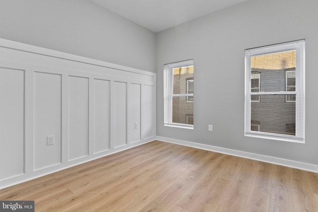 spare room featuring light hardwood / wood-style floors