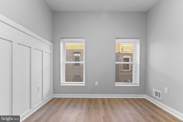 unfurnished bedroom featuring light wood-type flooring